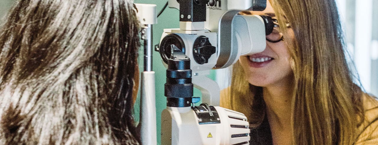 A doctor performing an eye exam