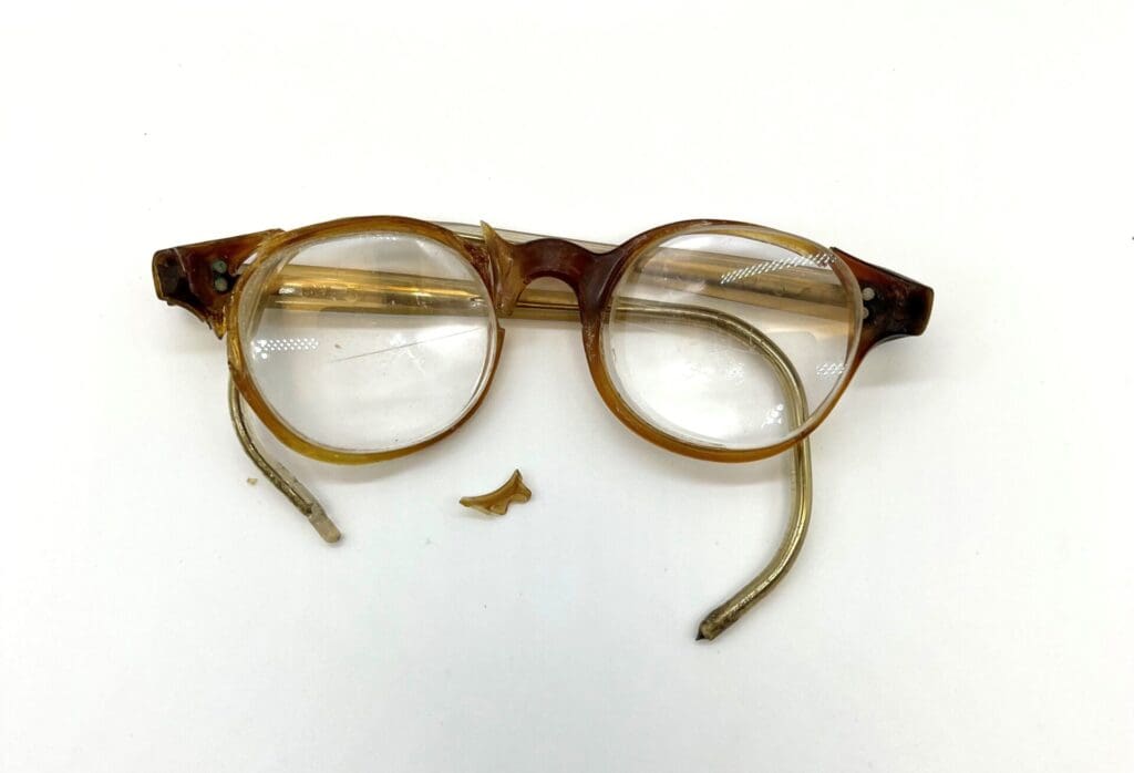 Pair of broken, brown and yellow baby glasses